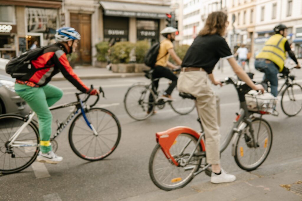 Cyclists navigating traffic, highlighting the importance of safety gear to prevent traumatic brain injuries and protect Florida legal claims.